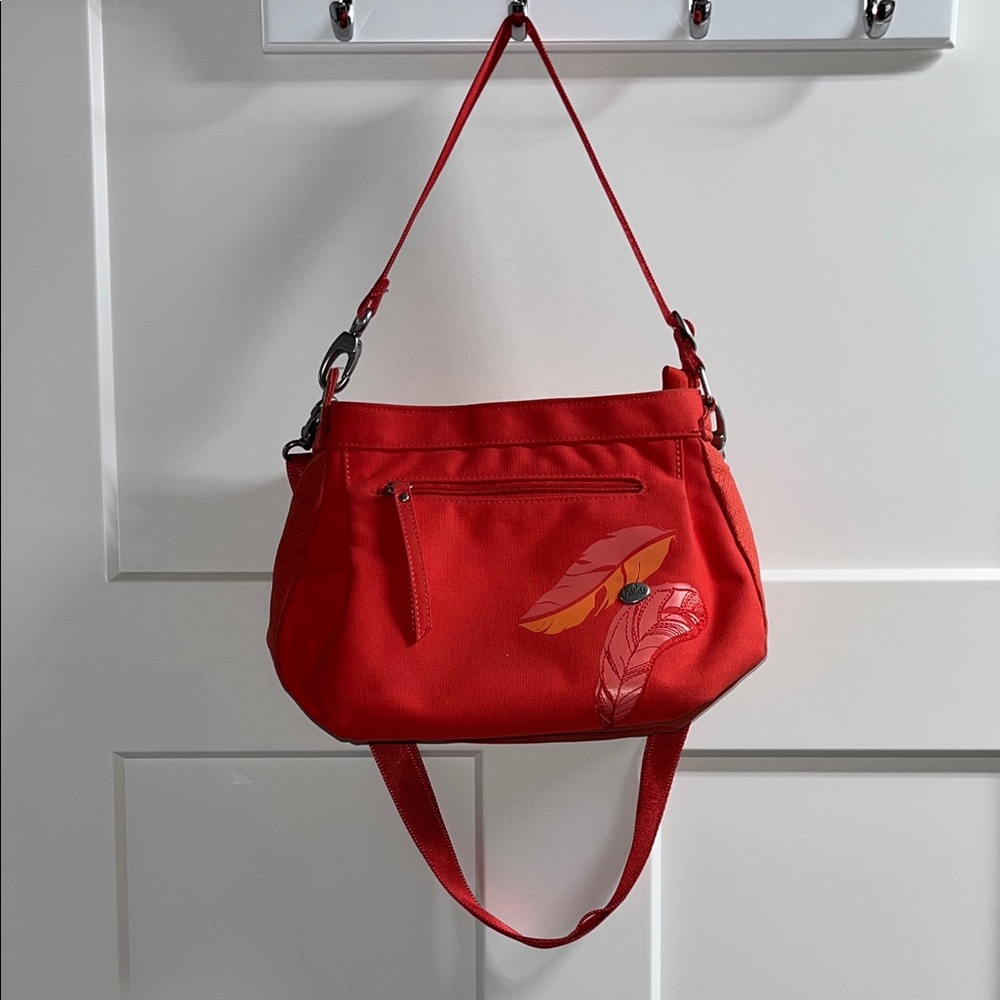 Haiku convertible crossbody purse. 8.5” tall x 12” wide x 5.5” deep.